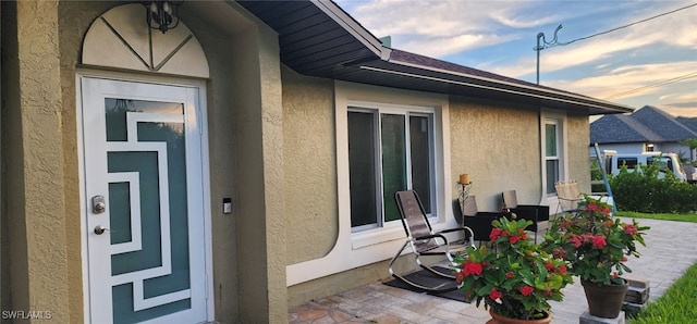 3101 12th St W, Lehigh Acres, FL 33971 - view of exterior entry with stucco siding