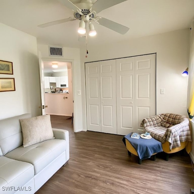 5735 Foxlake Dr Unit 1, North Fort Myers, FL 33917 - living area with ceiling fan and dark wood-style flooring