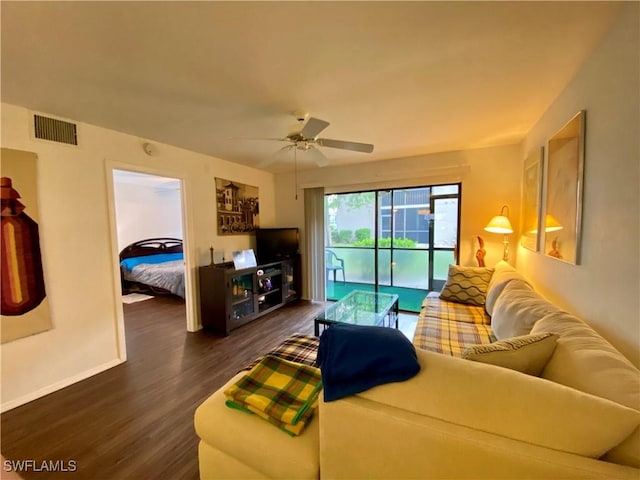 5735 Foxlake Dr Unit 1, North Fort Myers, FL 33917 - living room featuring dark wood-style floors and ceiling fan