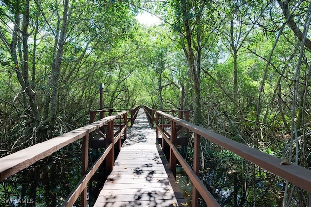 5735 Foxlake Dr Unit 1, North Fort Myers, FL 33917 - view of home's community featuring a forest view