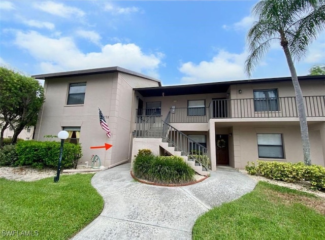 5735 Foxlake Dr Unit 1, North Fort Myers, FL 33917 - view of property featuring stairway