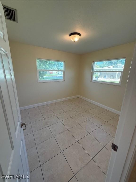 401 W Oregon Rd, Lehigh Acres, FL 33971 - spare room featuring light tile patterned flooring