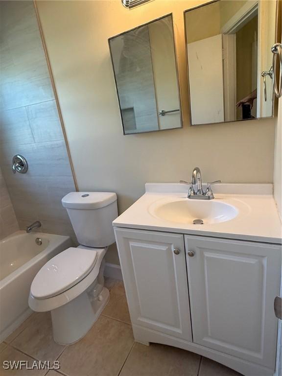 401 W Oregon Rd, Lehigh Acres, FL 33971 - bathroom with vanity, tile patterned floors, and bathing tub / shower combination