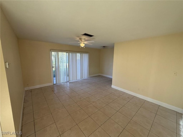 401 W Oregon Rd, Lehigh Acres, FL 33971 - empty room featuring light tile patterned floors and a ceiling fan