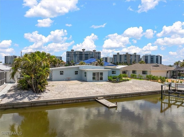 8336 Lagoon Rd, Fort Myers Beach, FL 33931 - back of property featuring a water view and a patio
