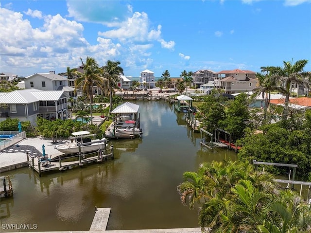 8336 Lagoon Rd, Fort Myers Beach, FL 33931 - dock area with boat lift, a water view, and a residential view