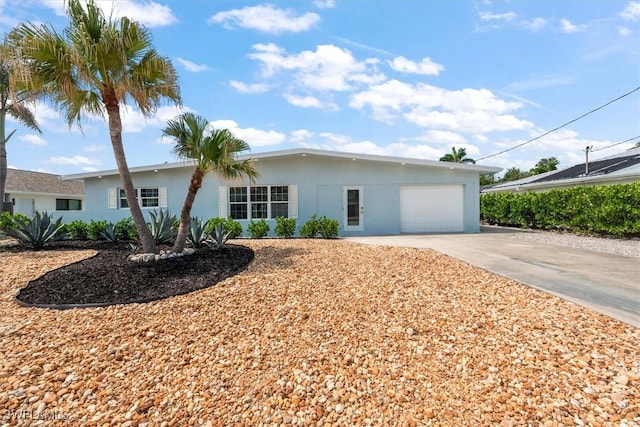 8336 Lagoon Rd, Fort Myers Beach, FL 33931 - single story home featuring a garage, concrete driveway, and stucco siding