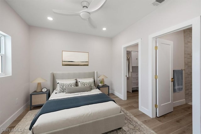 8336 Lagoon Rd, Fort Myers Beach, FL 33931 - bedroom featuring light wood finished floors, a spacious closet, a ceiling fan, and recessed lighting