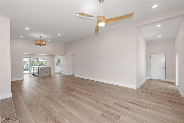 8336 Lagoon Rd, Fort Myers Beach, FL 33931 - unfurnished living room featuring light wood-style floors, recessed lighting, and ceiling fan