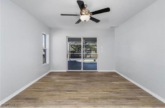 609 SW 22nd St, Cape Coral, FL 33991 - spare room with a ceiling fan and wood finished floors