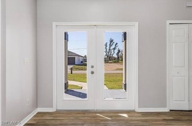 609 SW 22nd St, Cape Coral, FL 33991 - doorway to outside with french doors and wood finished floors