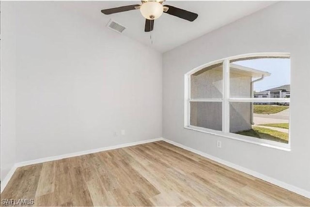 609 SW 22nd St, Cape Coral, FL 33991 - spare room with wood finished floors and a ceiling fan