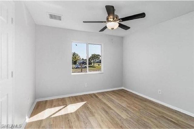 609 SW 22nd St, Cape Coral, FL 33991 - spare room with wood finished floors and ceiling fan