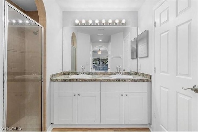 609 SW 22nd St, Cape Coral, FL 33991 - bathroom featuring double vanity and a stall shower