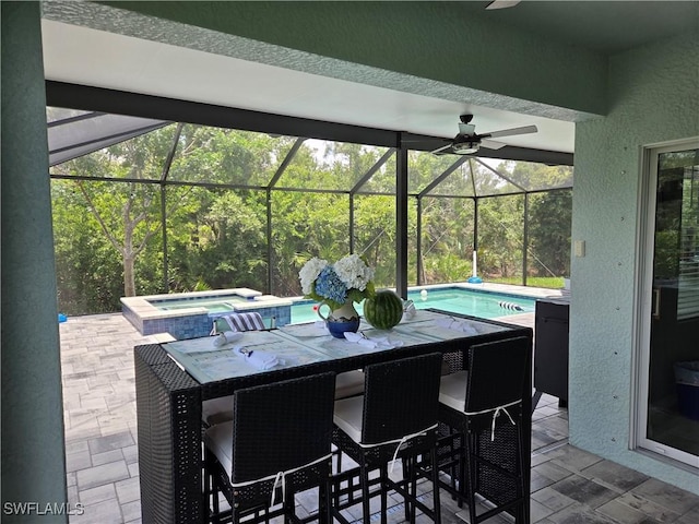 8868 E Cascade Price Cir, North Fort Myers, FL 33917 - view of patio with ceiling fan, a pool with connected hot tub, and a lanai