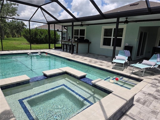 8868 E Cascade Price Cir, North Fort Myers, FL 33917 - view of pool with a pool with connected hot tub, a patio area, and a ceiling fan