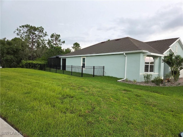 8868 E Cascade Price Cir, North Fort Myers, FL 33917 - view of property exterior featuring stucco siding and roof with shingles