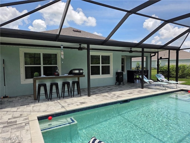 8868 E Cascade Price Cir, North Fort Myers, FL 33917 - swimming pool featuring a patio area, a ceiling fan, and glass enclosure