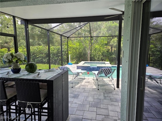 8868 E Cascade Price Cir, North Fort Myers, FL 33917 - view of patio with a pool with connected hot tub and glass enclosure