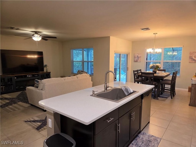 8868 E Cascade Price Cir, North Fort Myers, FL 33917 - kitchen featuring dishwasher, a chandelier, light tile patterned flooring, light countertops, and open floor plan