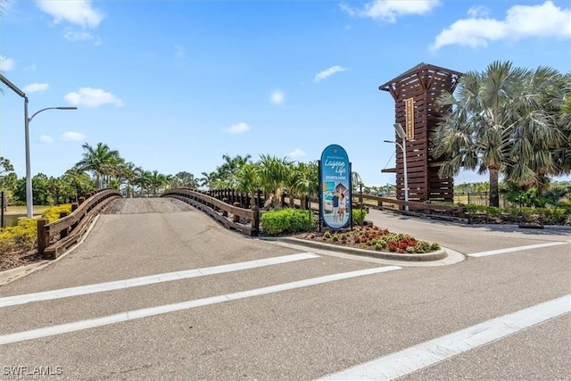 8868 E Cascade Price Cir, North Fort Myers, FL 33917 - view of asphalt road with street lights and curbs