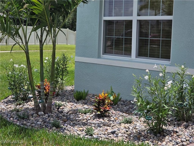 8868 E Cascade Price Cir, North Fort Myers, FL 33917 - view of property exterior with stucco siding