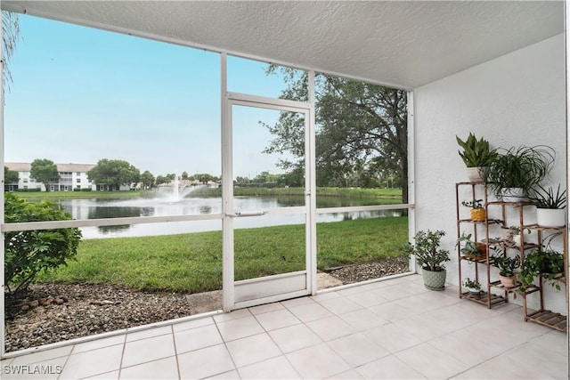 9580 Victoria Ln Unit A106, Naples, FL 34109 - sunroom / solarium featuring a water view and healthy amount of natural light