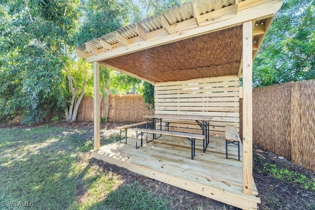 3064 Connecticut Ave, Naples, FL 34112 - wooden terrace featuring a fenced backyard