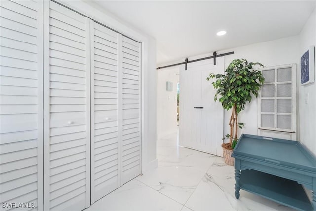 3064 Connecticut Ave, Naples, FL 34112 - corridor with marble finish floors, a barn door, and recessed lighting