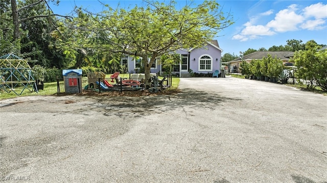 4440 40th St NE, Naples, FL 34120 - view of front of house featuring stucco siding