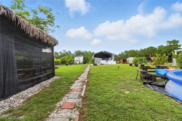 4440 40th St NE, Naples, FL 34120 - view of green lawn with a detached carport