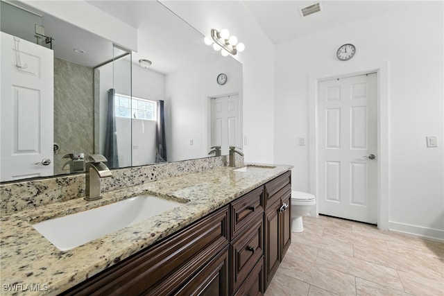 4440 40th St NE, Naples, FL 34120 - full bathroom with double vanity and toilet