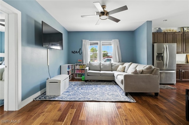 4440 40th St NE, Naples, FL 34120 - living room featuring a ceiling fan and dark wood finished floors