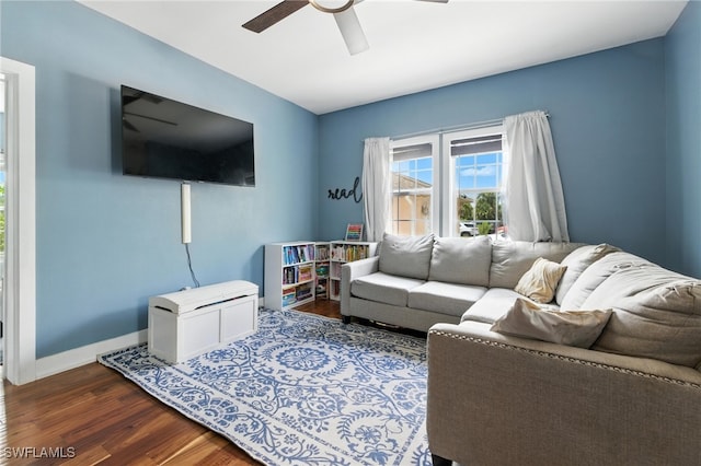 4440 40th St NE, Naples, FL 34120 - living area with ceiling fan and dark wood-style floors