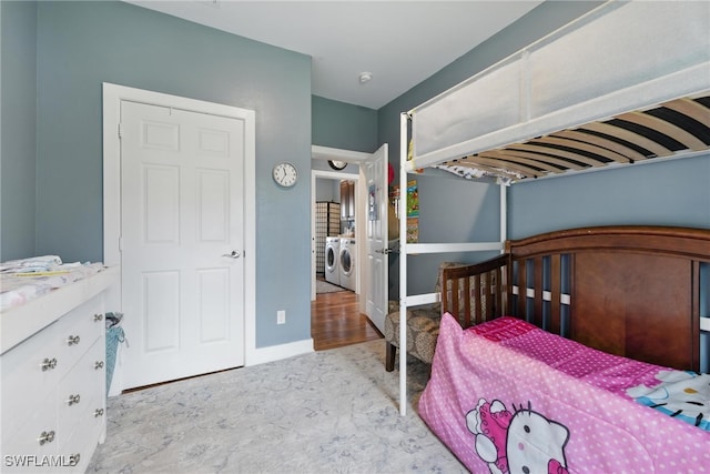 4440 40th St NE, Naples, FL 34120 - carpeted bedroom featuring independent washer and dryer and baseboards