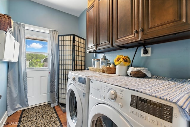 4440 40th St NE, Naples, FL 34120 - laundry room with cabinet space, washing machine and clothes dryer, and light wood-style floors
