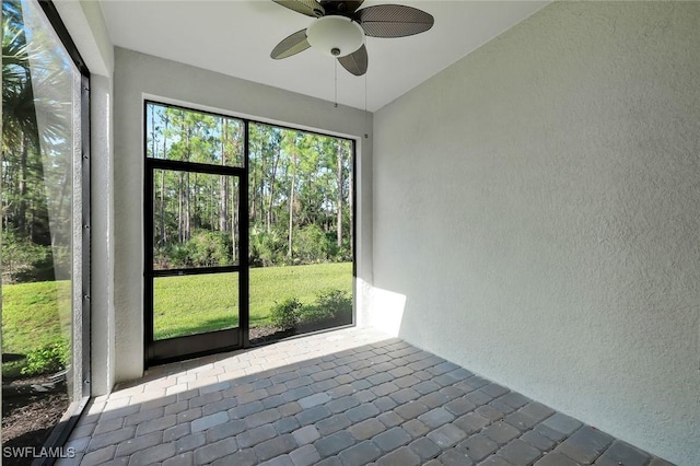 4184 Sonoma Oaks Cir, Naples, FL 34119 - unfurnished sunroom with a ceiling fan