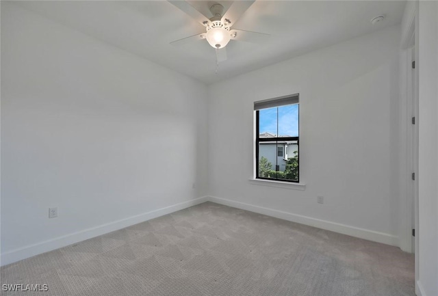 4184 Sonoma Oaks Cir, Naples, FL 34119 - spare room featuring light carpet, a smoke detector, and ceiling fan