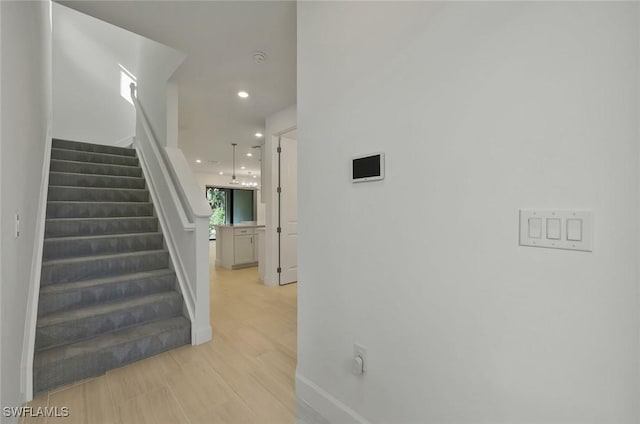 4184 Sonoma Oaks Cir, Naples, FL 34119 - staircase featuring recessed lighting and wood finished floors