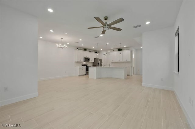 4184 Sonoma Oaks Cir, Naples, FL 34119 - unfurnished living room with a chandelier, ceiling fan, and recessed lighting