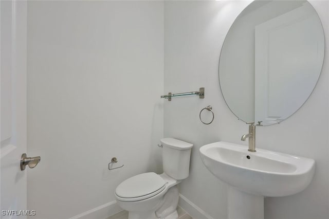 4184 Sonoma Oaks Cir, Naples, FL 34119 - half bath featuring baseboards and a sink