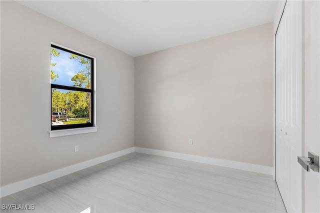 2717 10th Ave SE, Naples, FL 34117 - spare room with baseboards