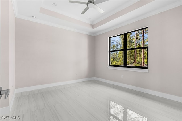2717 10th Ave SE, Naples, FL 34117 - unfurnished room with a raised ceiling, ornamental molding, and ceiling fan