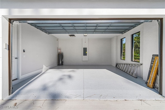 2717 10th Ave SE, Naples, FL 34117 - garage featuring electric panel and electric water heater