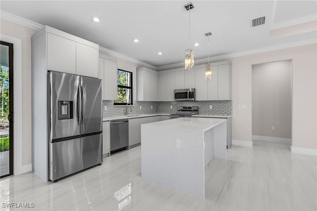 2717 10th Ave SE, Naples, FL 34117 - kitchen featuring appliances with stainless steel finishes, decorative backsplash, a center island, pendant lighting, and recessed lighting