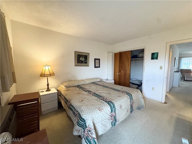 13150 Kings Point Dr Unit 11C, Fort Myers, FL 33919 - bedroom with light colored carpet and a closet