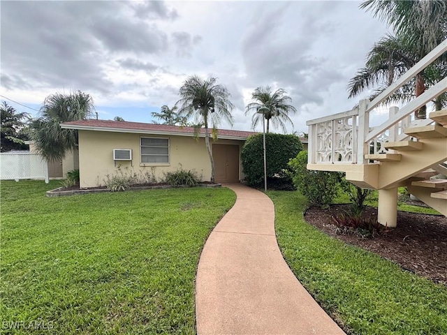 13150 Kings Point Dr Unit 11C, Fort Myers, FL 33919 - view of front facade with stucco siding and stairs