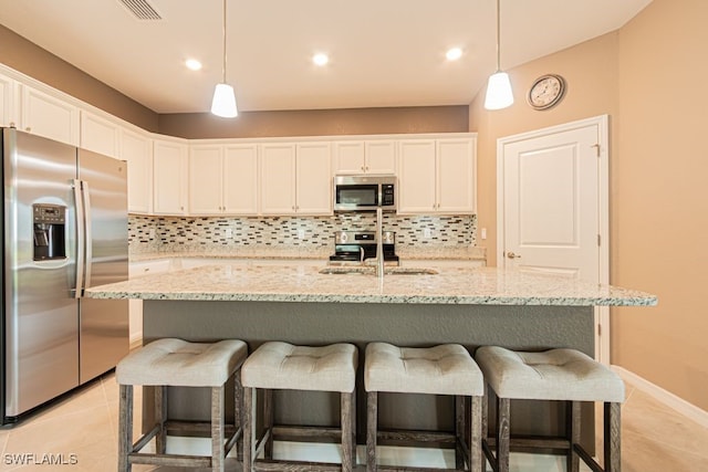 3943 E Hampton Cir, Alva, FL 33920 - kitchen featuring stainless steel appliances, backsplash, white cabinets, and recessed lighting