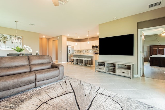 3943 E Hampton Cir, Alva, FL 33920 - living room with a ceiling fan and light tile patterned floors