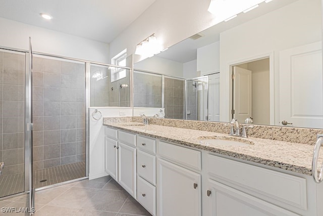 3943 E Hampton Cir, Alva, FL 33920 - full bath featuring double vanity, a stall shower, and tile patterned flooring